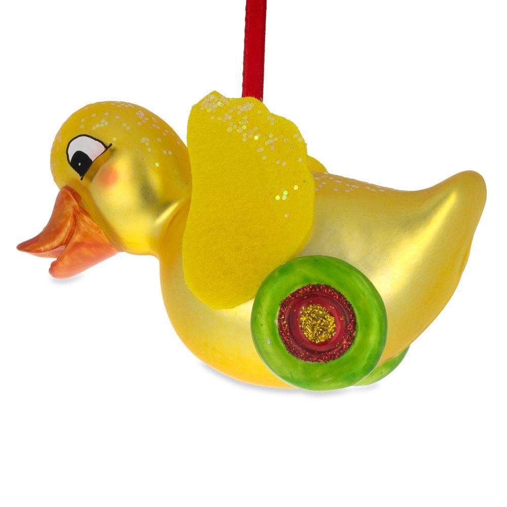 Yellow Duck Rolling On Wheels – Blown Glass Christmas Ornament